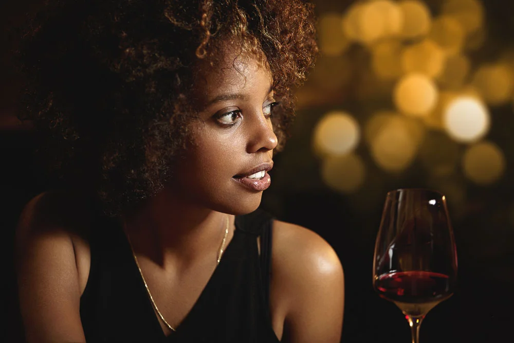 A picture of an African woman with curly hair. depicting elegance...