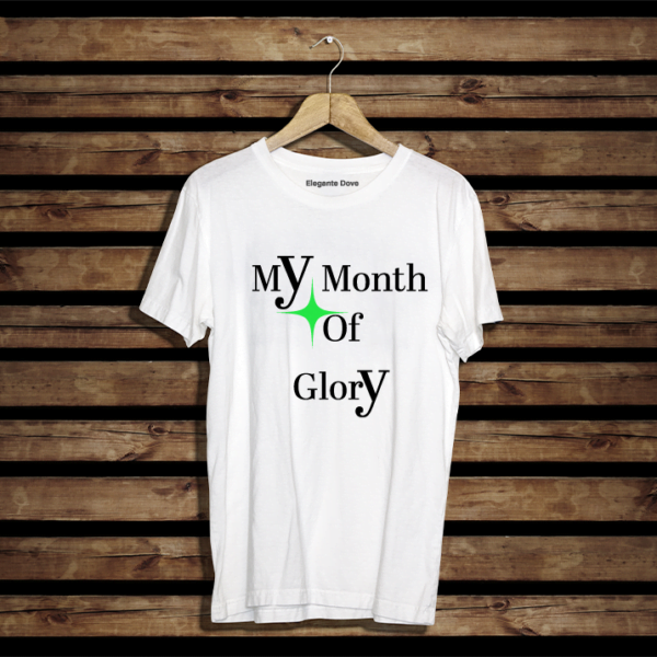 Heavy Cotton T-shirt. Regular fit. Featuring a Star and Text "My month of Glory". T-shirt colour white. Star Colour Green. Text colour. Black